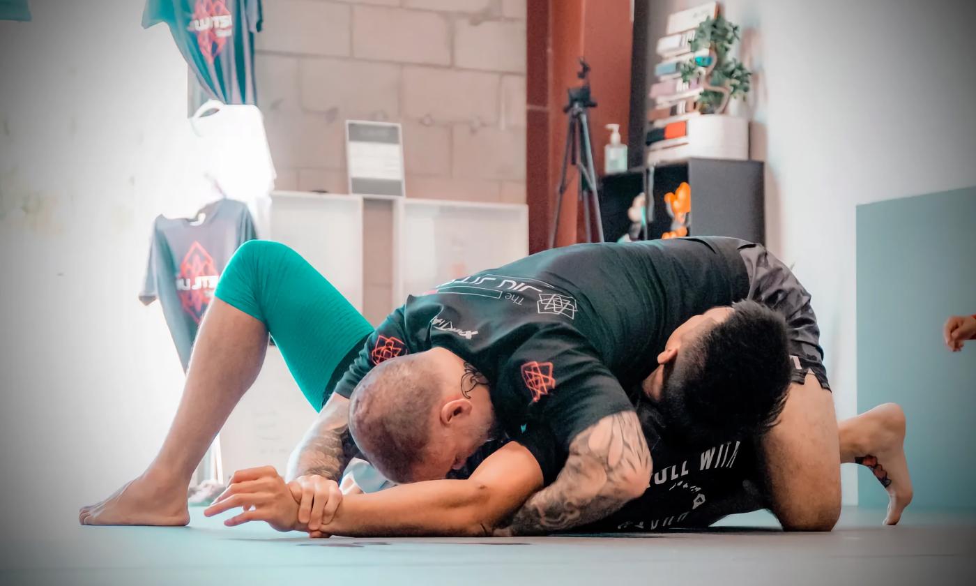 Two students learning no-gi Jiu Jitsu skills