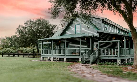 The log cabin at Ancient City Farmstead during sunset