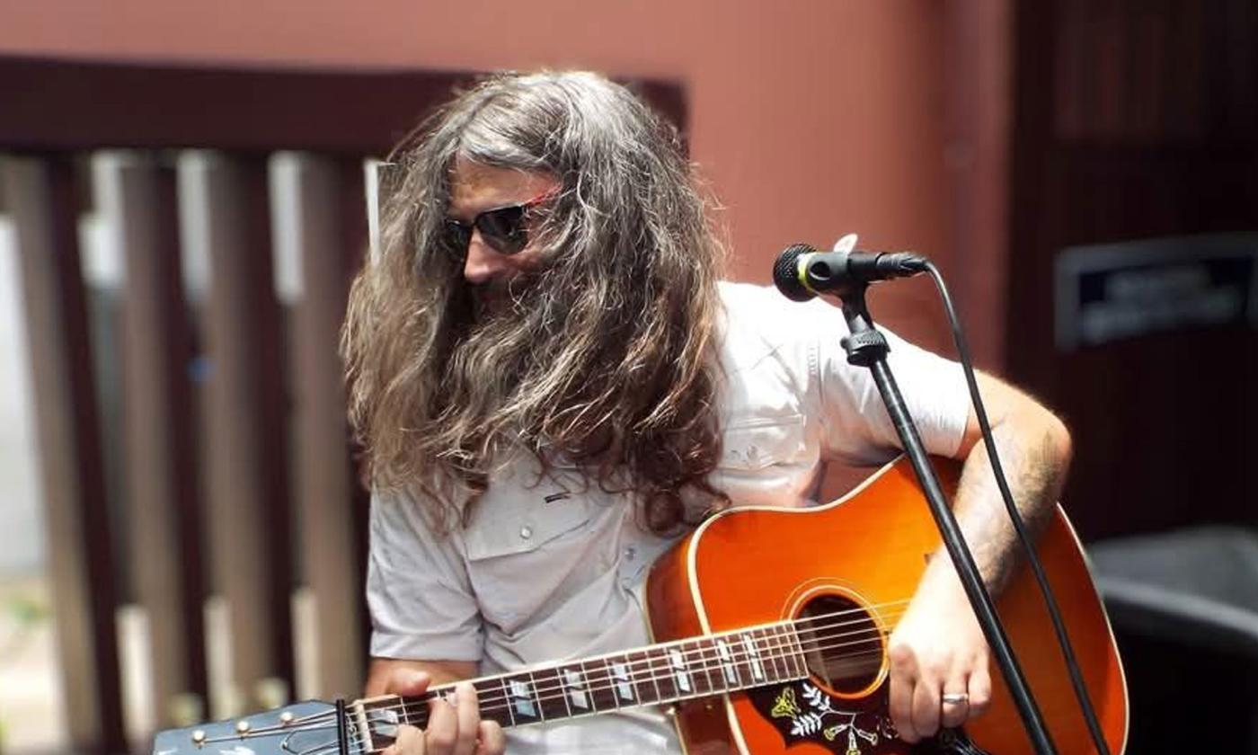 Image courtest Paul Poag, Tennessee playing his guitar, with enthusiasm